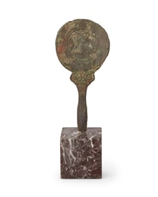 A Greek bronze hand mirror