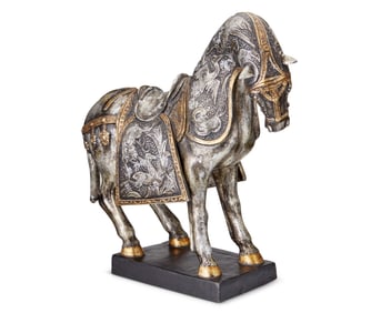 A silvered and gilt ceramic figure of a horse