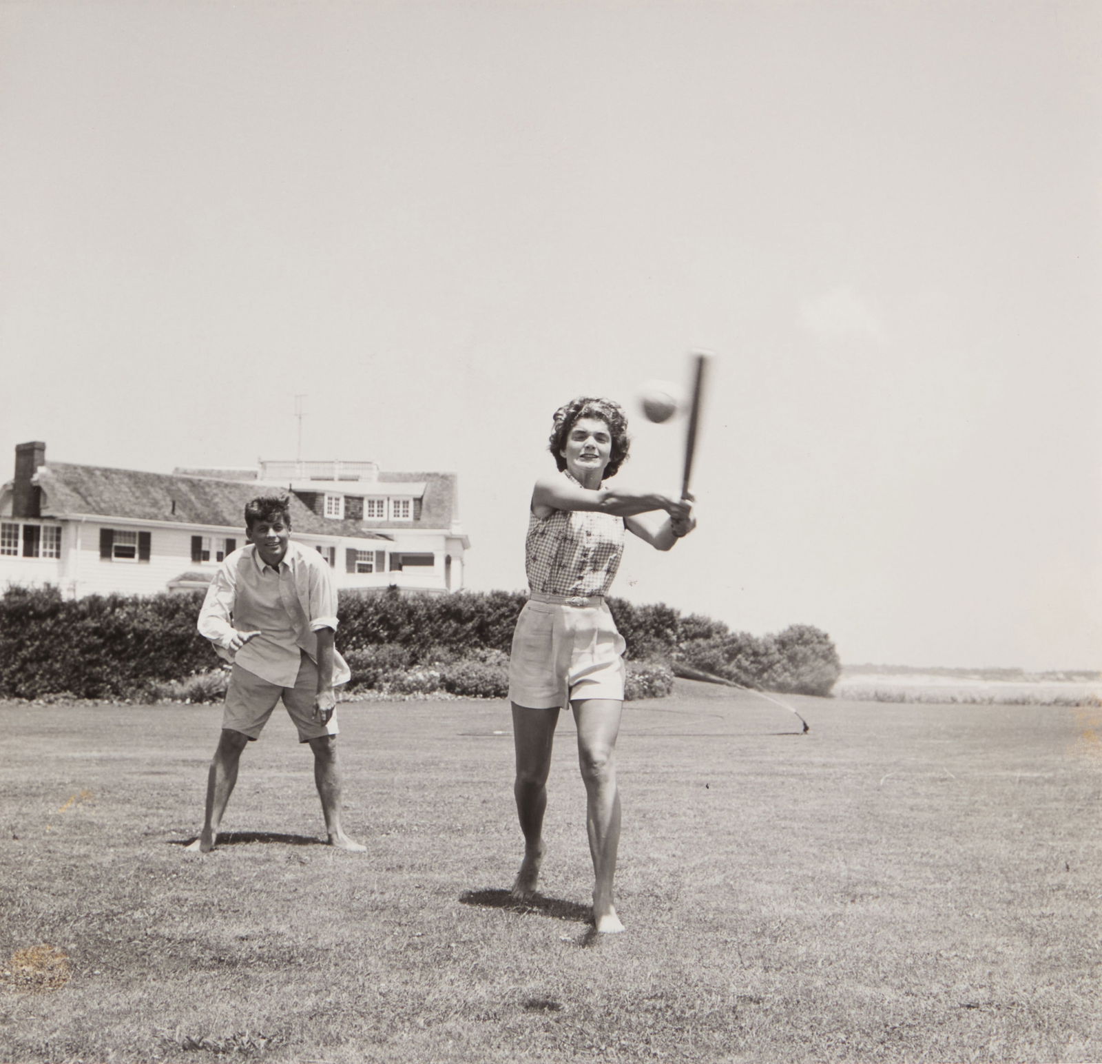 Hy Peskin (1915-2005), "John and Jackie Play Ball": Hy Peskin(1915-2005)"John and Jackie Play Ball"Gelatin silver print on paperUnsigned; with the artist's name stamped in blue ink, versoImage: 7.5" H x 7.5" W; Sight: 8" H x 8" W Other Notes:
