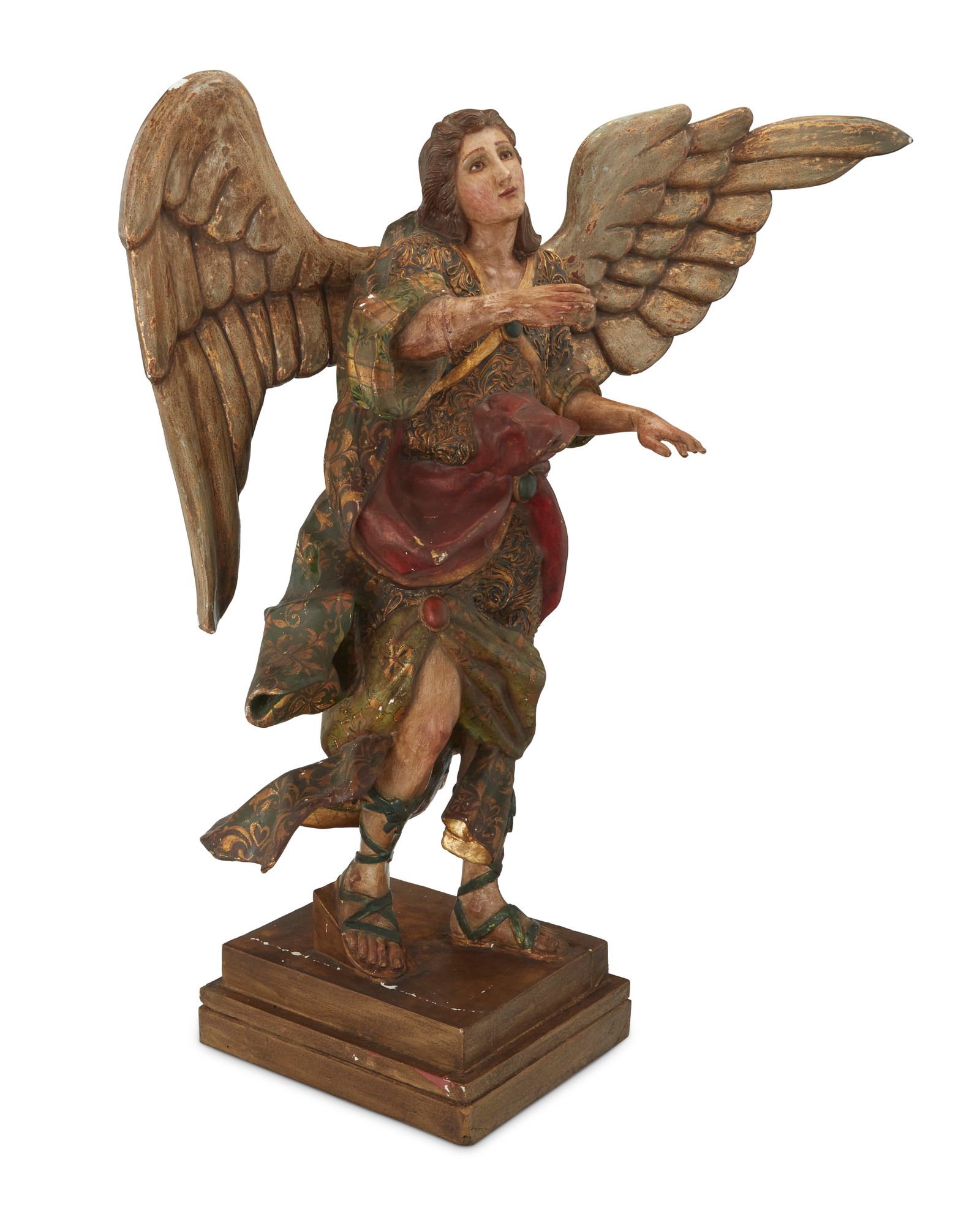 A Continental polychrome carved wood figure of an archangel: A Continental polychrome carved wood figure of an archangel19th centuryPlinth with applied indecipherable tag versoPainted and gilt, mounted with wings and raised on a tiered plinthFigure without wing