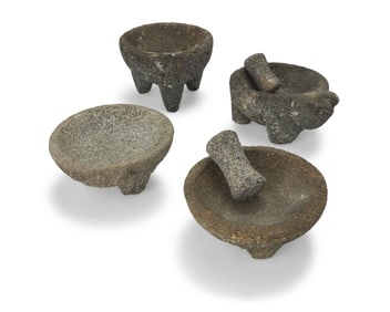 Four Mexican carved stone molcajetes