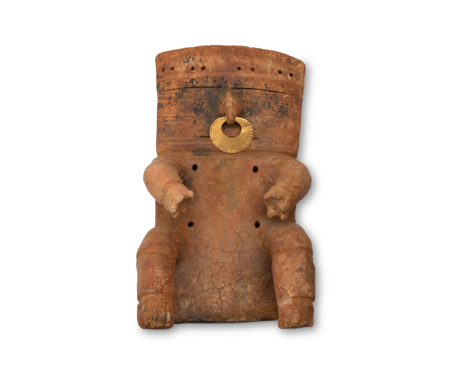 A Pre-Columbian Quimbaya pottery slab figure: A Pre-Columbian Quimbaya pottery slab figureCirca 800 CE; ColombiaThe ceramic figure with perforated and incised accents, featuring a hand-wrought gold alloy nose piece with repousse dotted border11.8