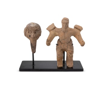 A Pre-Columbian pottery masked figure