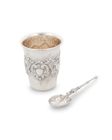 A sterling silver cup and spoon