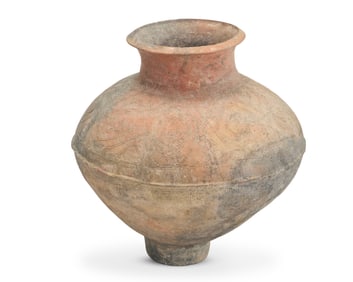 A terracotta pottery storage vessel