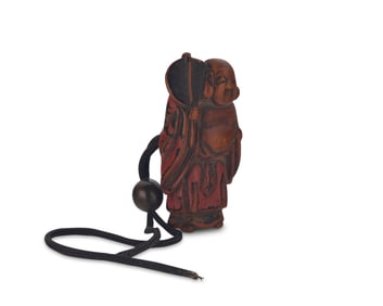 An East Asian lacquered boxwood figural netsuke