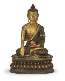 A Tibeto-Chinese parcel gilt bronze figure of Shakyamuni Buddha