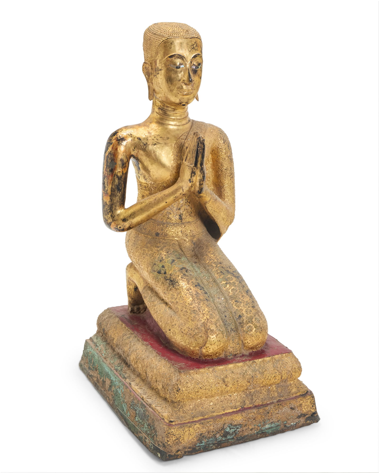 A Southeast Asian gilt bronze kneeling Buddhist monk devotee: A Southeast Asian gilt bronze kneeling Buddhist monk devoteeRattanakosin Period (1782-1932) or laterPossibly Mogallana or Shariputra, with hands in anjali mudra and mother of pearl inlaid eyes and rob