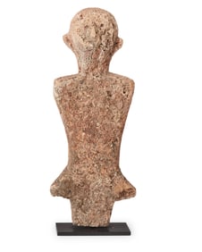 An Indonesian carved stone figure