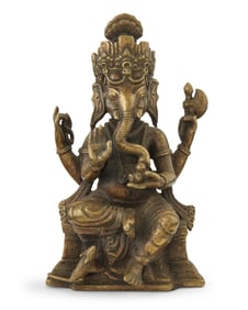 An Indian brass figure of Ganesha
