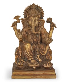 An Indian brass figure of Ganesha
