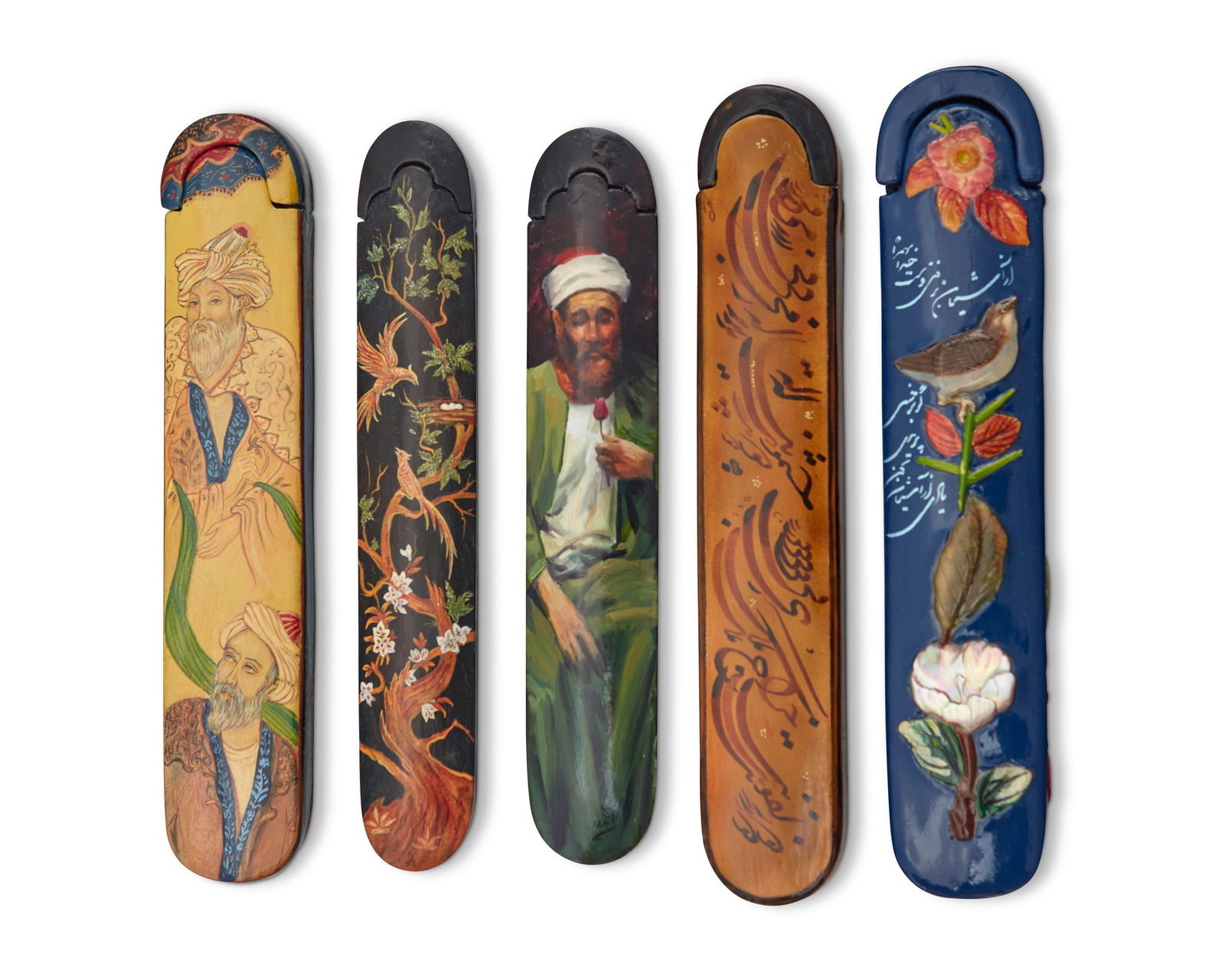 A group of Persian polychrome wood and papier-m‚che pen boxes: A group of Persian polychrome wood and papier-m‚che pen boxes 20th century Each bearing inscriptions Comprising two depicting male figures, one depicting birds in a tree, another with shell inlaid