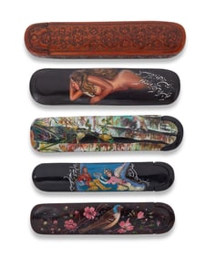 A group of Persian polychrome wood and papier-m‚che pen boxes