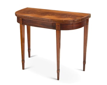 A Regency inlaid mahogany games table