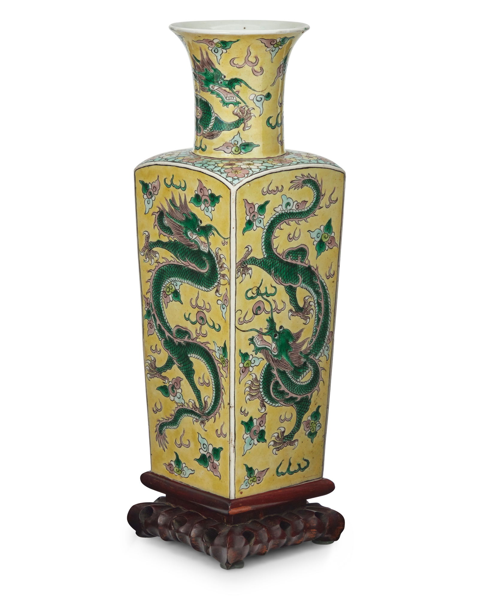 A Chinese Famille Jaune porcelain dragon vase: A Chinese Famille Jaune porcelain dragon vase Late Qing Dynasty/Republic Period (1644-1949) Bearing an apocryphal reign mark for Kangxi Period (1662-1722) Raised on a carved hardwood stand Vase: 14"