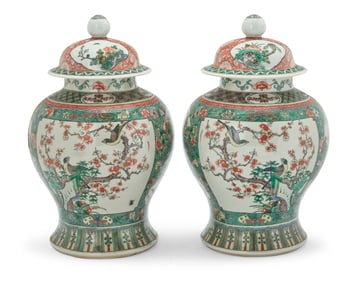 A pair of Chinese Famille Verte porcelain lidded jars