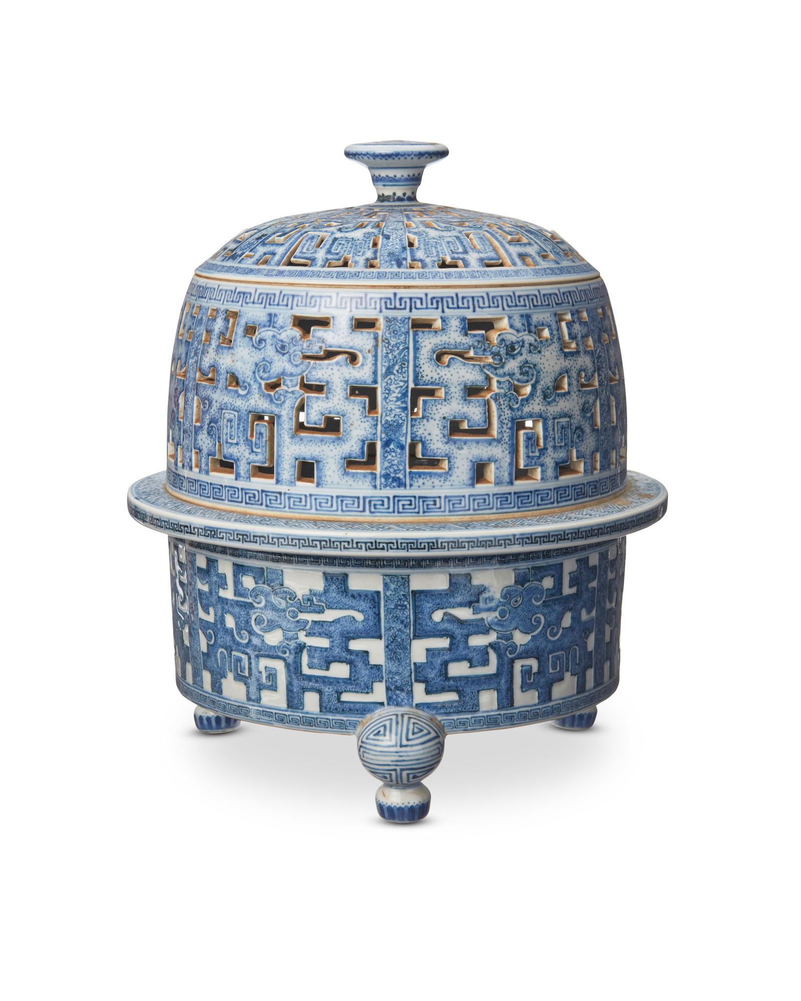 A Chinese blue and white porcelain tripod censer: A Chinese blue and white porcelain tripod censerRepublic Era (1912-1949) or earlierUnmarkedThe three-part footed censer with reticulated lid and midsection, decorated with meandering and figural motif