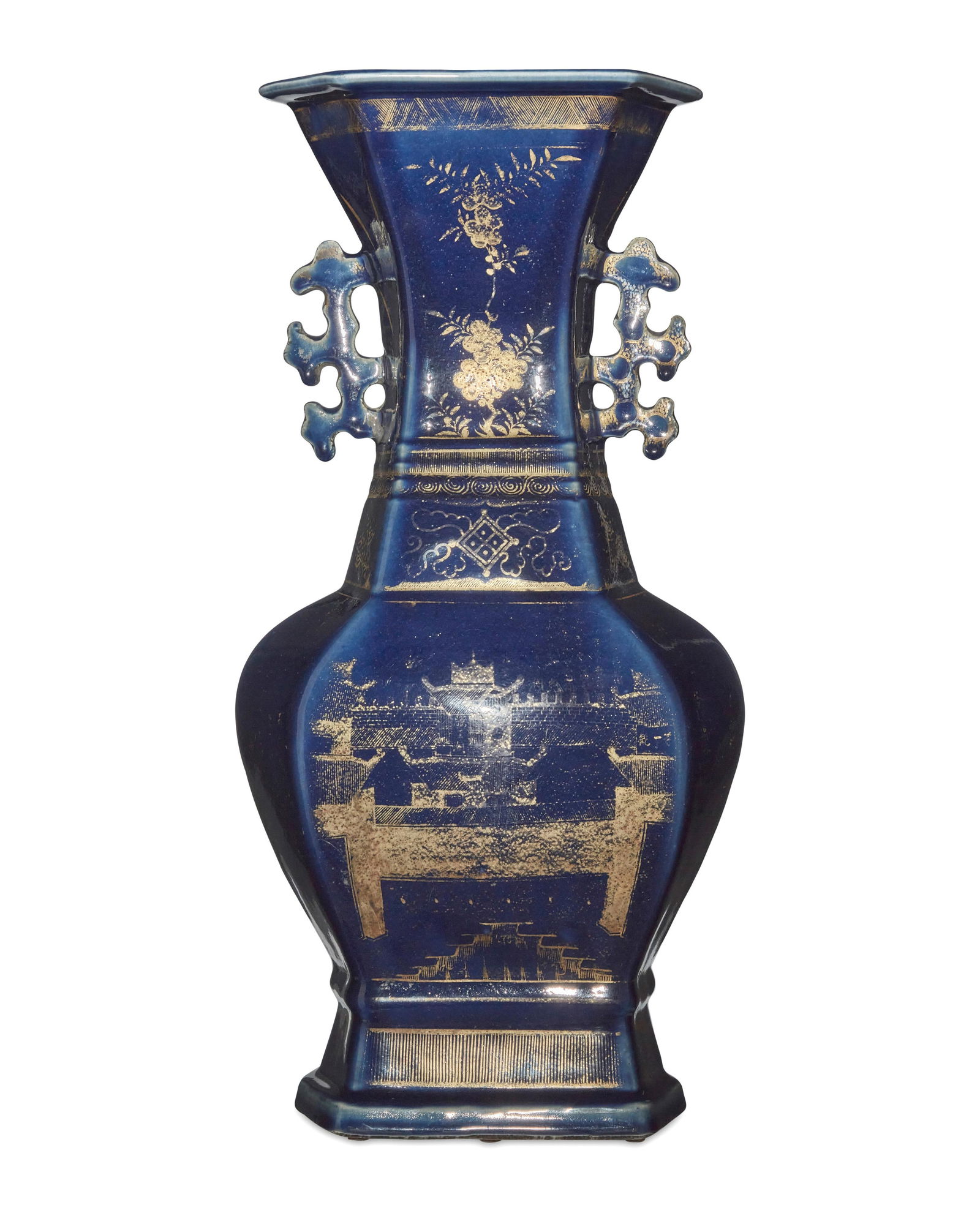 A Chinese cobalt blue porcelain hexagonal vase: A Chinese cobalt blue porcelain hexagonal vaseLikely Late Qing Dynasty (1644-1912), circa 19th centuryUnmarkedWith pierced foliate handles, gilt decorated depicting a compound and various foliate moti