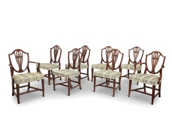 A set of eight George III style mahogany dining chairs