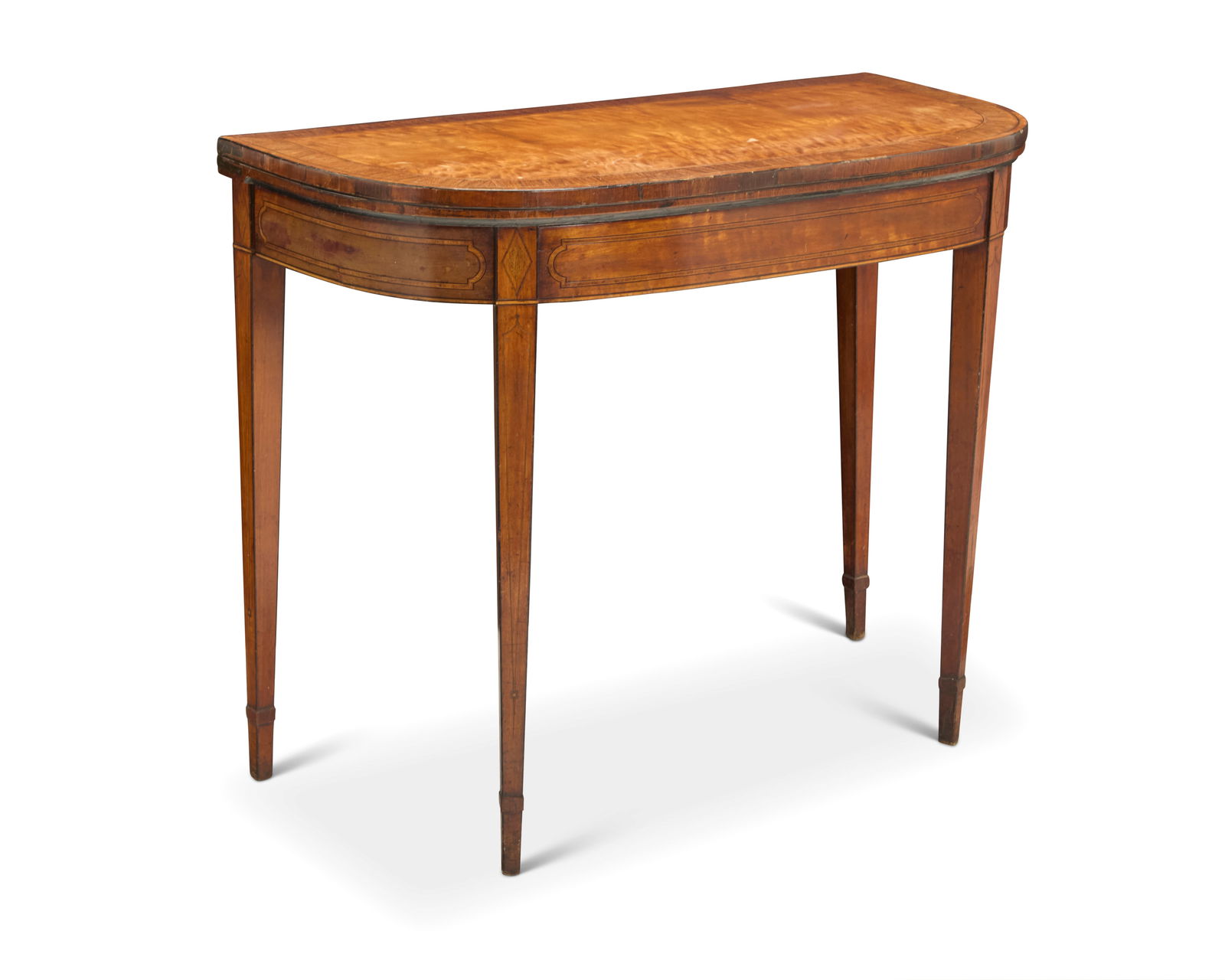 A George III mahogany and satinwood games table: A George III mahogany and satinwood games tableLate 18th/early 19th centuryWith burlwood veneer, the interior lined with green feltStored: 29.5" H x 36.25" W x 17.75" D; Open: 35.5" D Provenance:The E