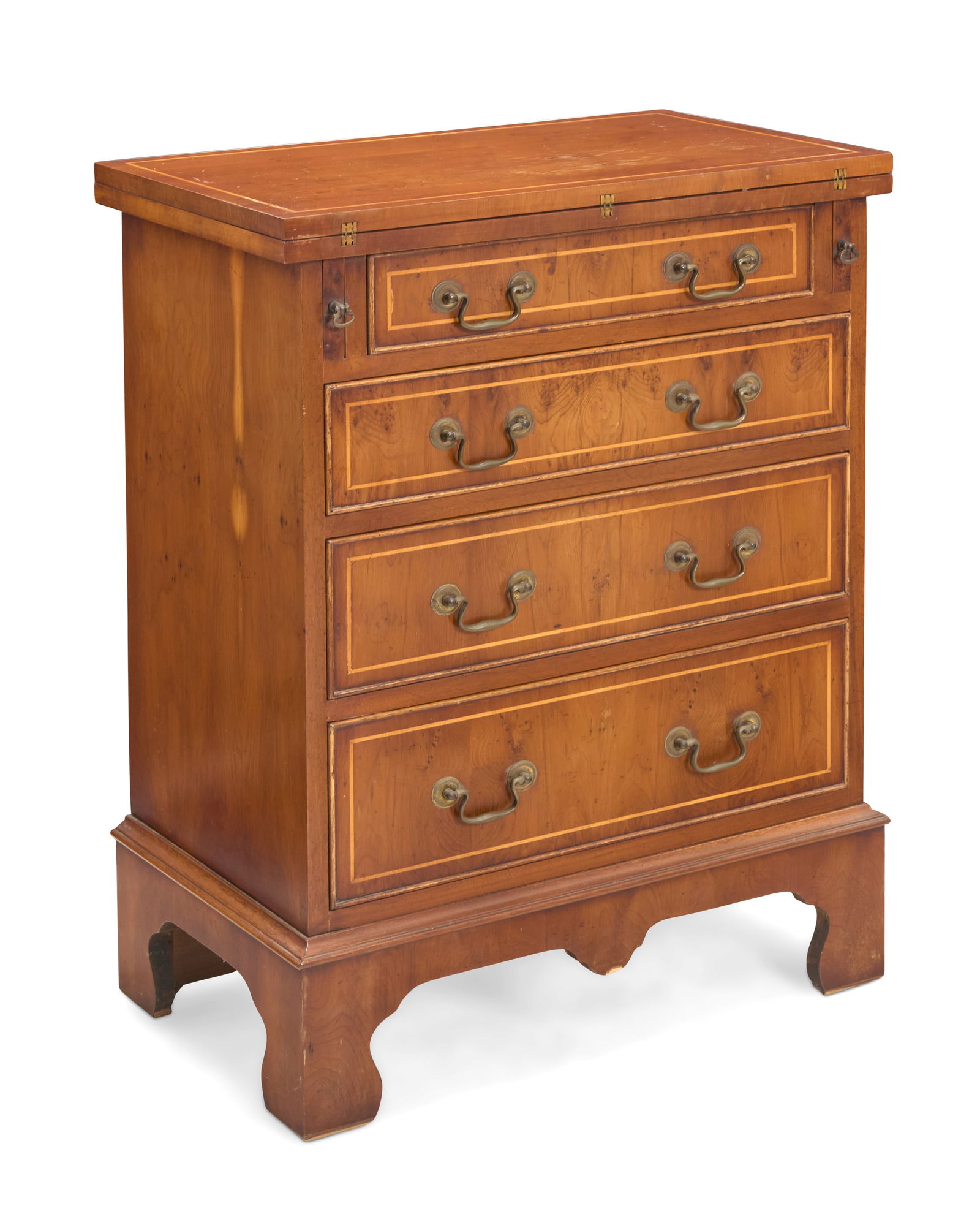 A George III style mixed wood bachelor's chest: A George III style mixed wood bachelor's chest Mid-20th century Stamped verso: Reprodux / Made in England With flip-top on pull-out supports above four drawers and raised on bracket feet Stored: