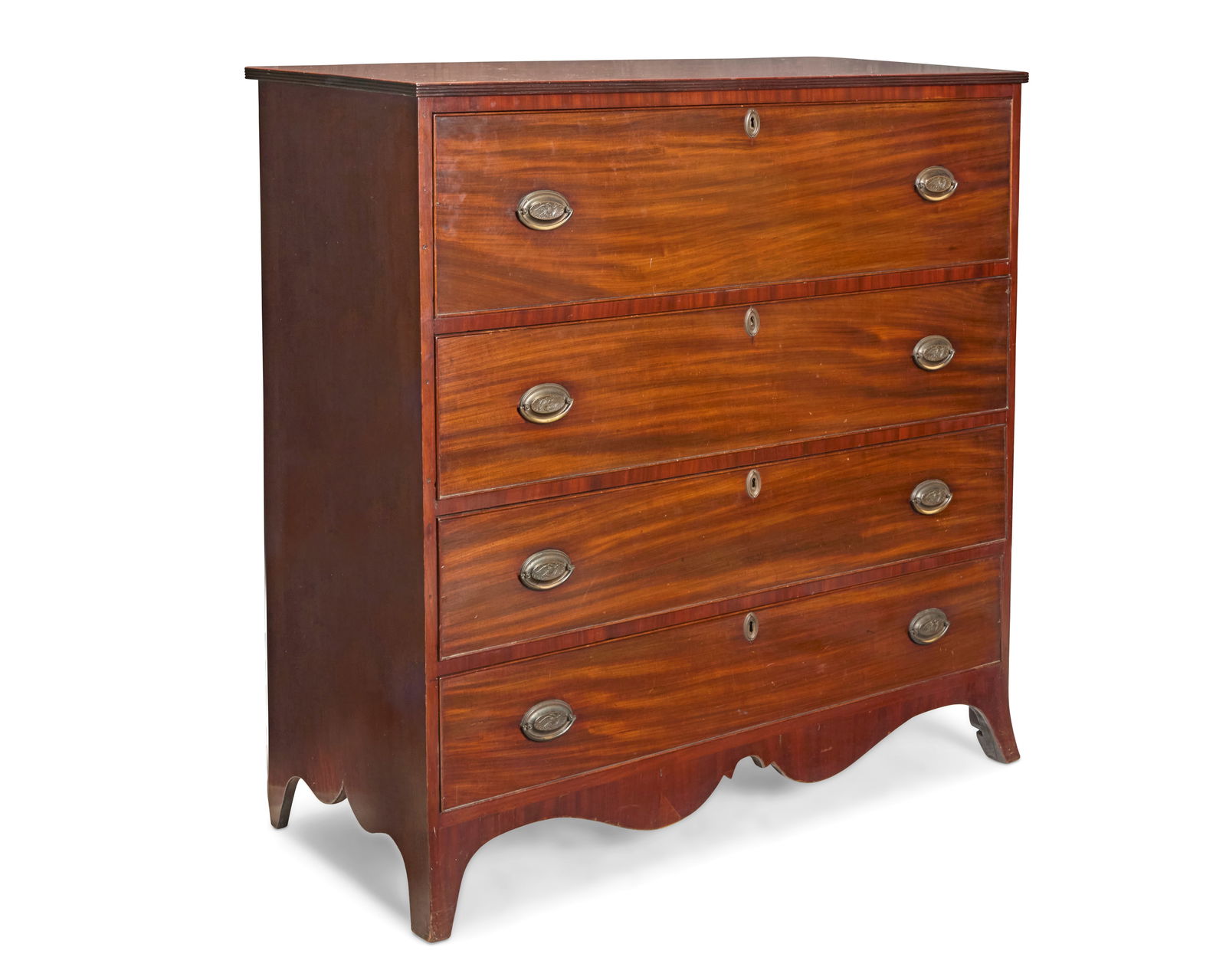 An American mahogany chest: An American mahogany chest 20th century With four locking drawers above a shaped apron and flared legs 47" H x 46.5" W x 19.25" D Provenance: The Estate of Herbert and Ann Lucas