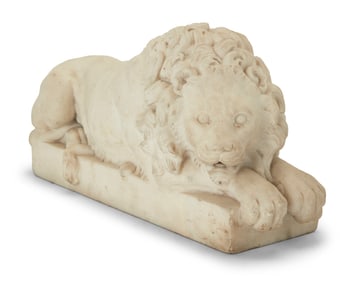 An Italian carved marble figure of a recumbent lion