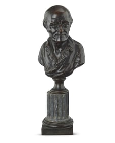 A patinated bronze bust of Voltaire