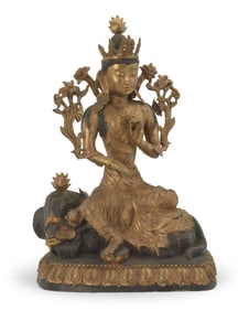 An Asian parcel gilt bronze figure of Samantabhadra