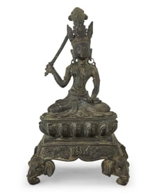 An Asian bronze figure of Manjusri
