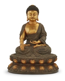 An Asian parcel gilt bronze Buddha figure