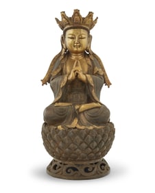 An Asian parcel gilt bronze figure of Vairocana