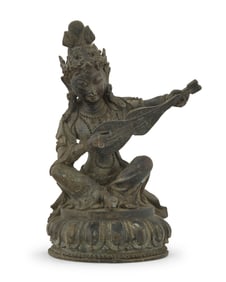 An Asian bronze figure of Saraswati