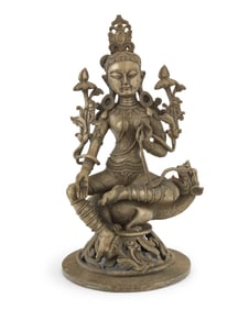 An Asian silvered bronze figure of Green Tara