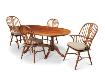 An assembled dining table and four Windsor chairs