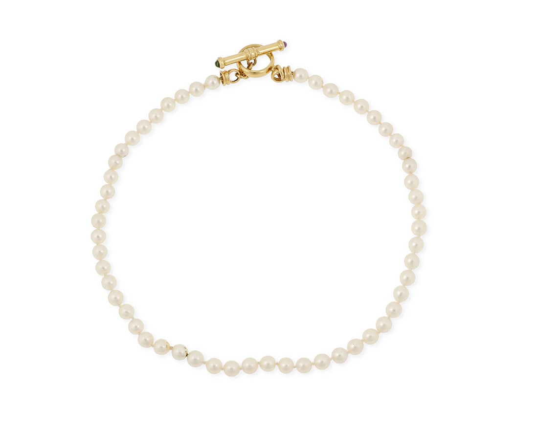 An 18K Gold, Cultured Pearl and Gem-Set Necklace: An 18K Gold, Cultured Pearl and Gem-Set Necklace Of a single strand design featuring cultured pearls measuring approximately 7.14- 7.50 mm, finished with an 18k gold toggle clasp accented by an