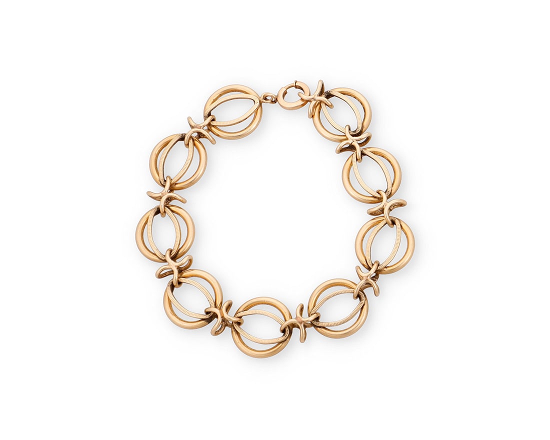 A 14K Gold Bracelet: A 14K Gold Bracelet Of a fancy link design Length: 8 in. 26.5 grams gross