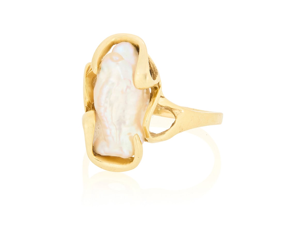 A 14K Gold and Baroque Pearl Ring: A 14K Gold and Baroque Pearl Ring Featuring a single baroque pearl set in an organic gold design Size: 8 1/4 4.3 grams gross