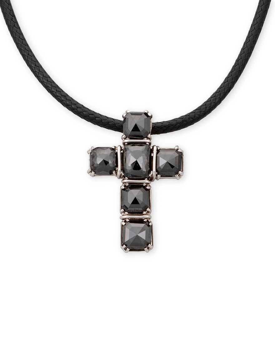 An 14K White Gold and Black Diamond Necklace: An 14K White Gold and Black Diamond Necklace Featuring a braided black corn suspending a white gold and six top faceted black diamonds cross pendant Length: 18 in., Pendant: 1 1/2 x 1 in. 12.6 grams
