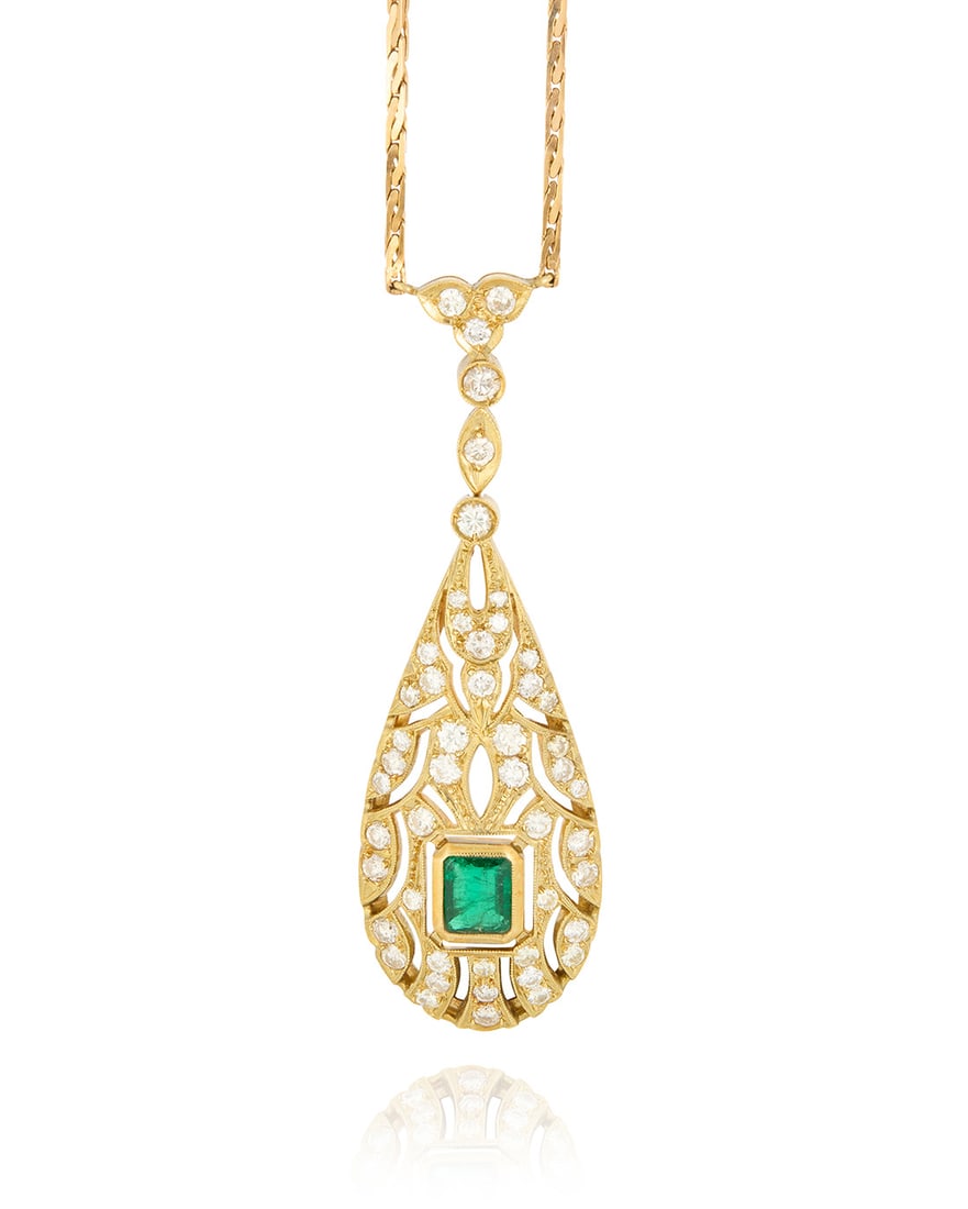 A 14K Gold, Emerald and Diamond Necklace: A 14K Gold, Emerald and Diamond Necklace Of a teardrop openwork design centering a cut-cornered rectangular step-cut emerald measuring approximately 5.87 x 4.75 mm, accented by round diamonds