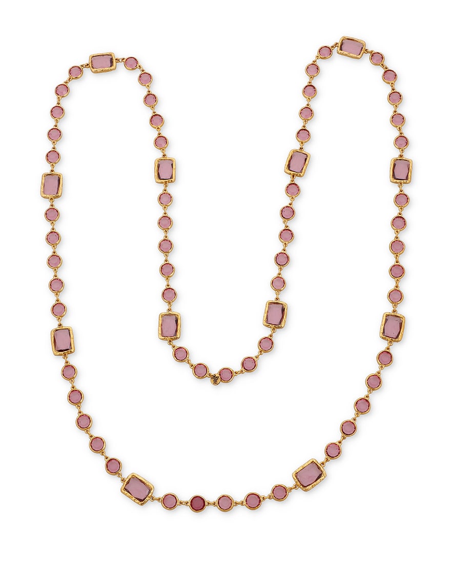 CHANEL: A Gold Tone and Purple Glass 'Chicklet' Necklace, 1981: CHANEL: A Gold Tone and Purple Glass 'Chicklet' Necklace, 1981 Designed as a long chain featuring round and rectangular amethyst colored glass links, signed on charm: Chanel, double C, 1981 Length: