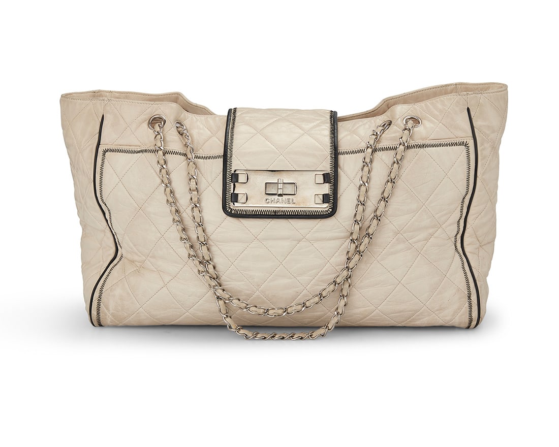 CHANEL: A Mademoiselle Lock East West Lambskin Bag, 2008: CHANEL: A Mademoiselle Lock East West Lambskin Bag, 2008 Circa 2008; Italy Marked to interior: Chanel / ® / Made in Italy; Carte D'Authenticite and interior tag: No. 12122653 A large tote bag in