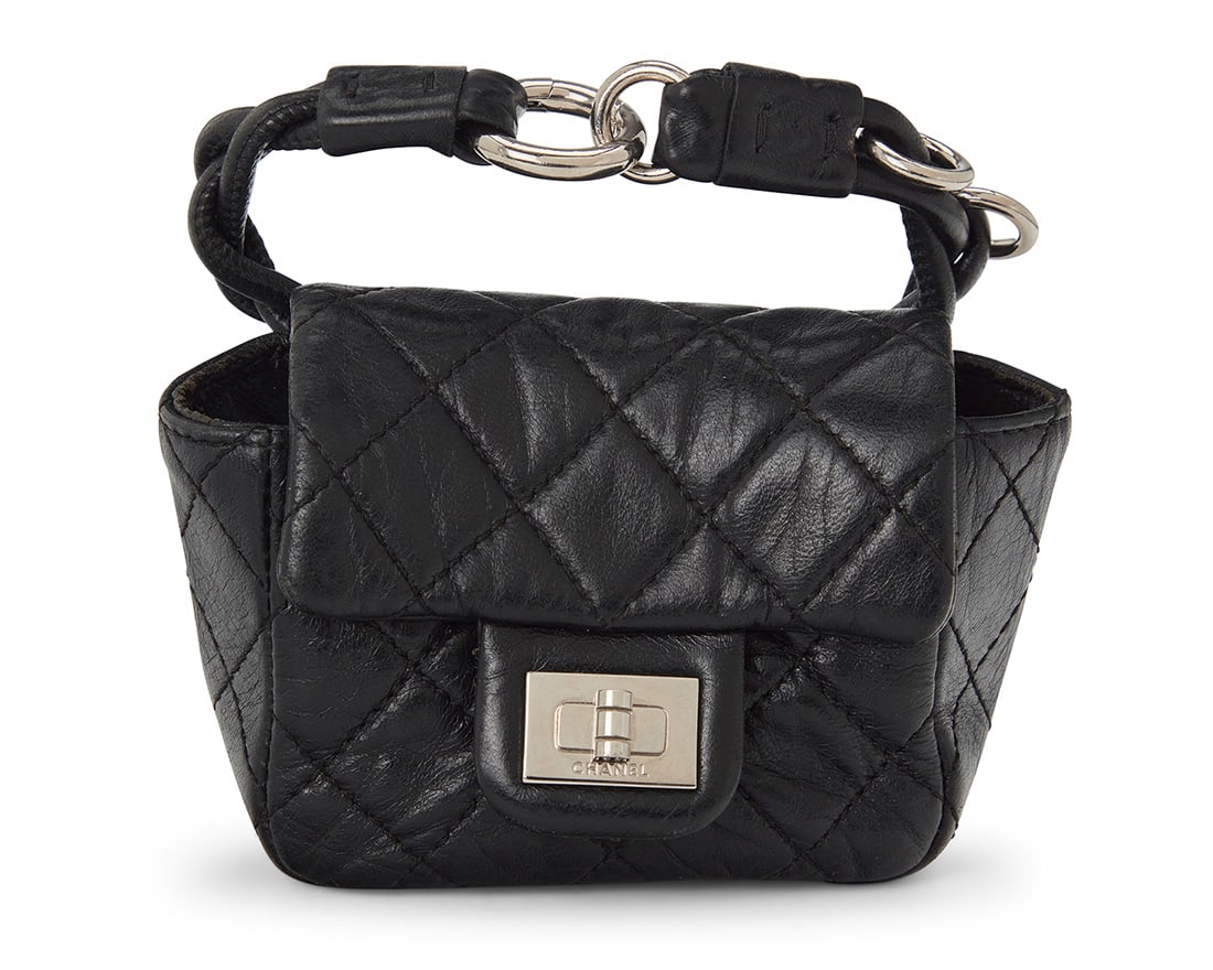 CHANEL: A Black Mini 2.55 Anklet Bag, 2008: CHANEL: A Black Mini 2.55 Anklet Bag, 2008 Circa 2008; France Marked to interior: Chanel / CC / Made in France; With interior tag: No 12010194 The anklet in diagonally quilted smooth black leather