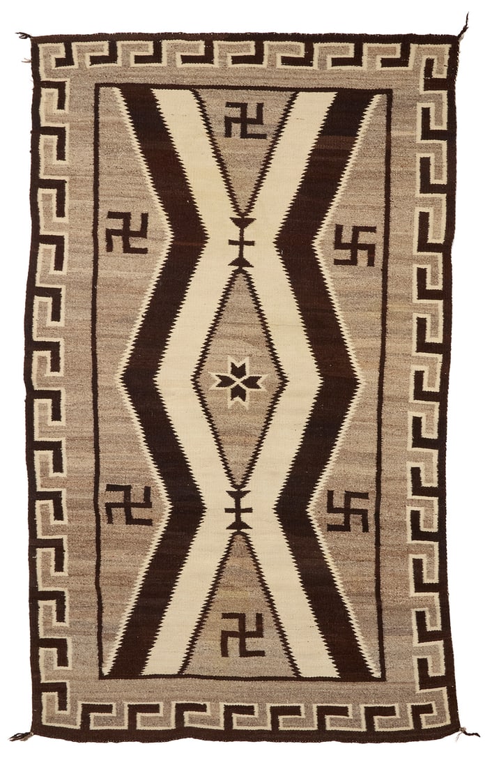 A Navajo regional rug Early 20th century, Dine Woven in cream, grey, and dark brown wool, with (1 of 3)