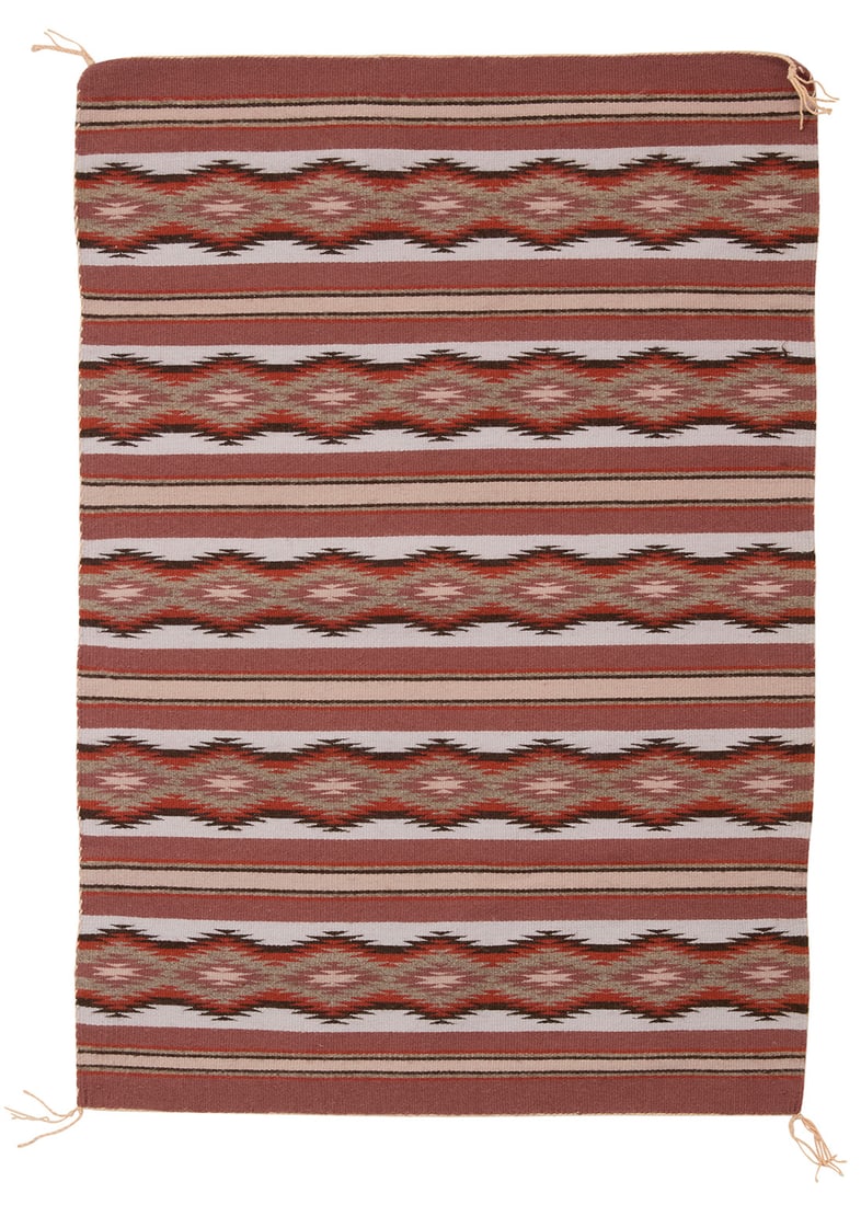 A Navajo Wide Ruins textile Late 20th century, Dine, Mary McCray Woven in burgundy, pale glue, (1 of 3)