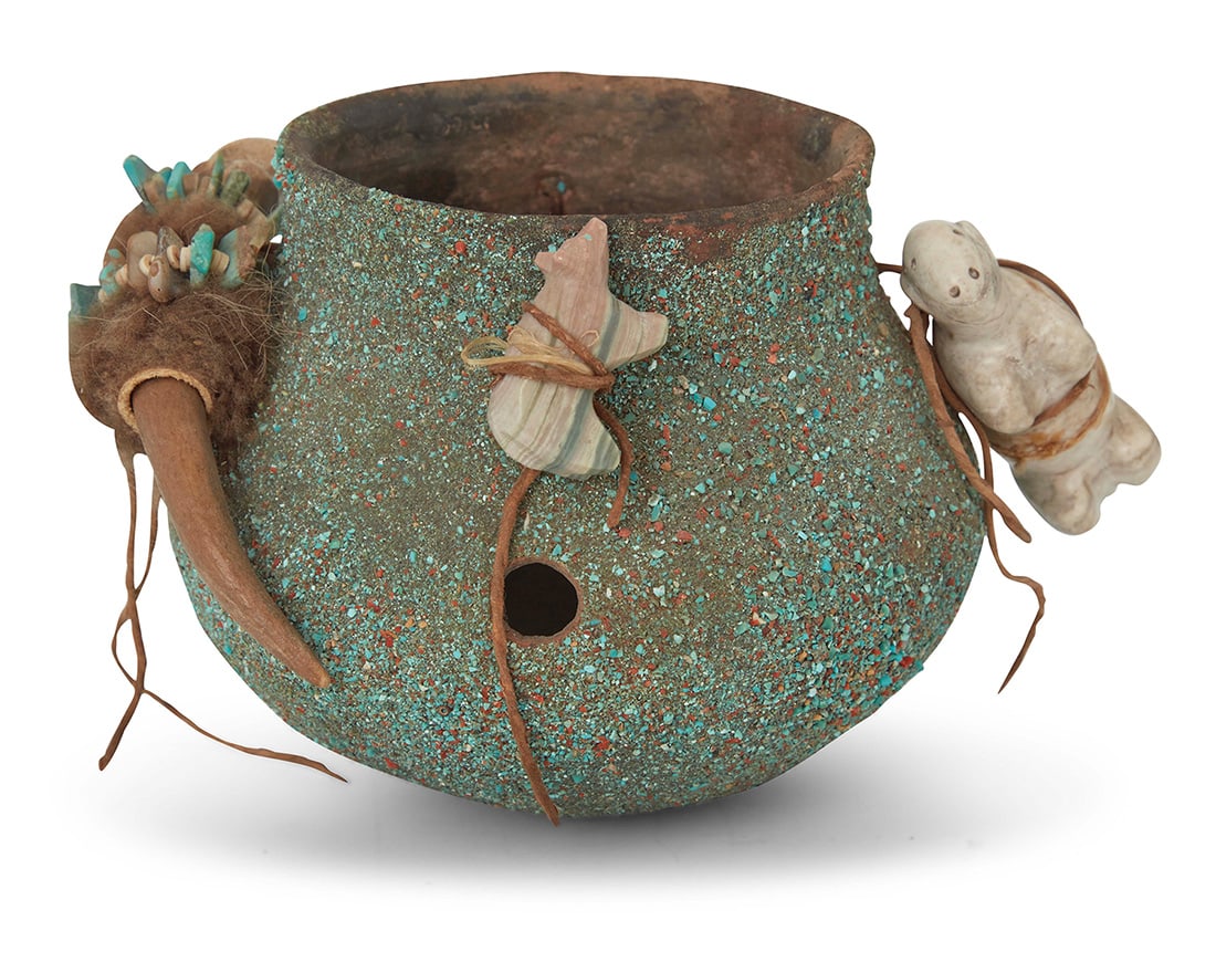 A Zuni Pueblo fetish pottery jar Late 20th century Unmarked Encrusted with turquoise and blended: A Zuni Pueblo fetish pottery jarLate 20th centuryUnmarkedEncrusted with turquoise and blended sand, adorned with carved stone or carved bone animal fetish figures fastened to the jar with hide straps,