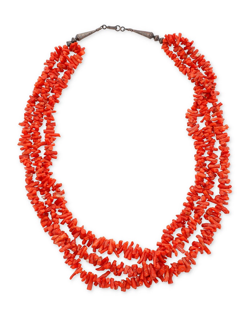 A Southwest Pueblo style multistrand coral necklace Mid/late 20th century Unmarked A three-strand: A Southwest Pueblo style multistrand coral necklaceMid/late 20th centuryUnmarkedA three-strand necklace of graduated branch coral beads, with silver cone terminals and clasp25" L121.1 grams gross