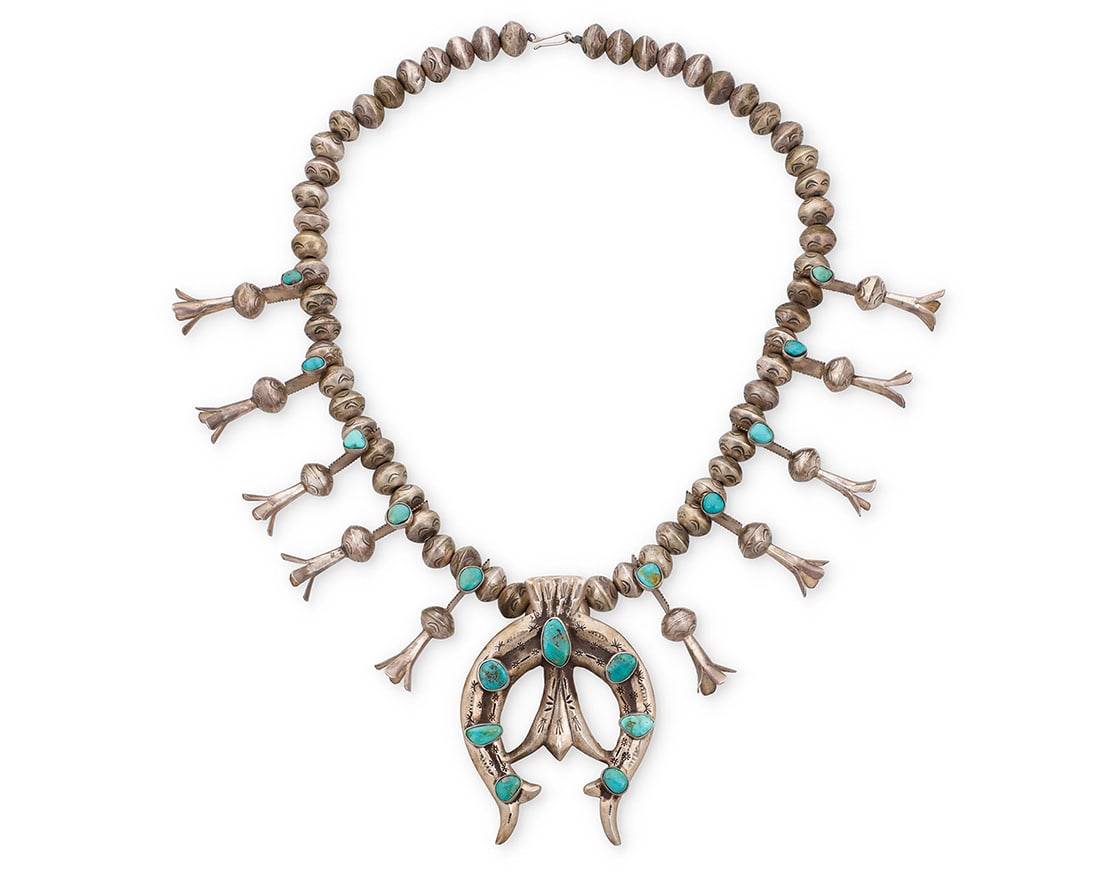 A Southwest silver and turquoise squash blossom necklace Early/mid-20th century Unmarked A chunky (1 of 2)