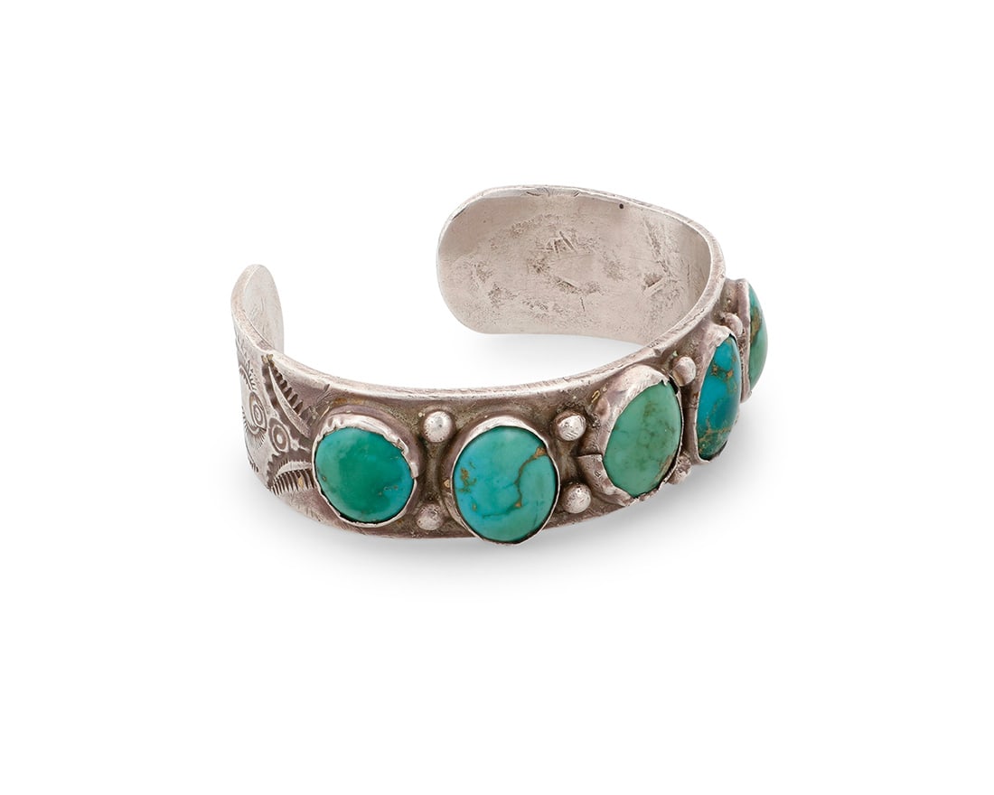 A Southwest silver and turquoise cuff bracelet Mid-20th century Unmarked A chunky cuff with five (1 of 2)