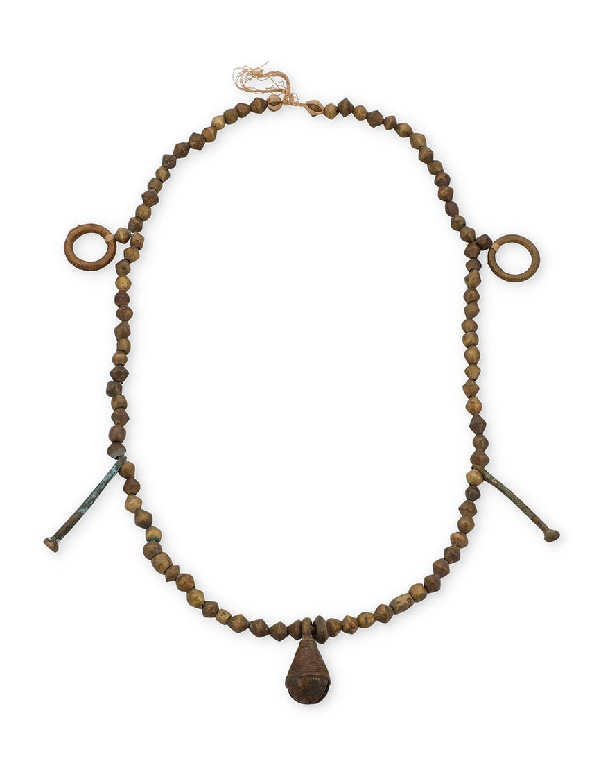 A late 19th century brass trade bead necklace Late 19th century Comprising a chunky necklace with (1 of 2)